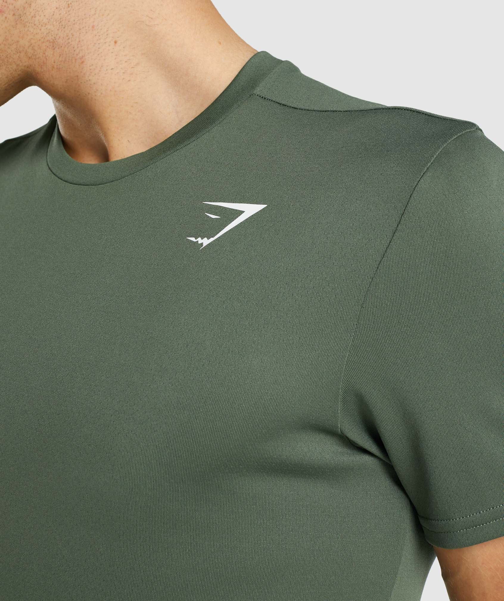 Camiseta Gymshark Arrival Hombre Verde | 6731408-OJ