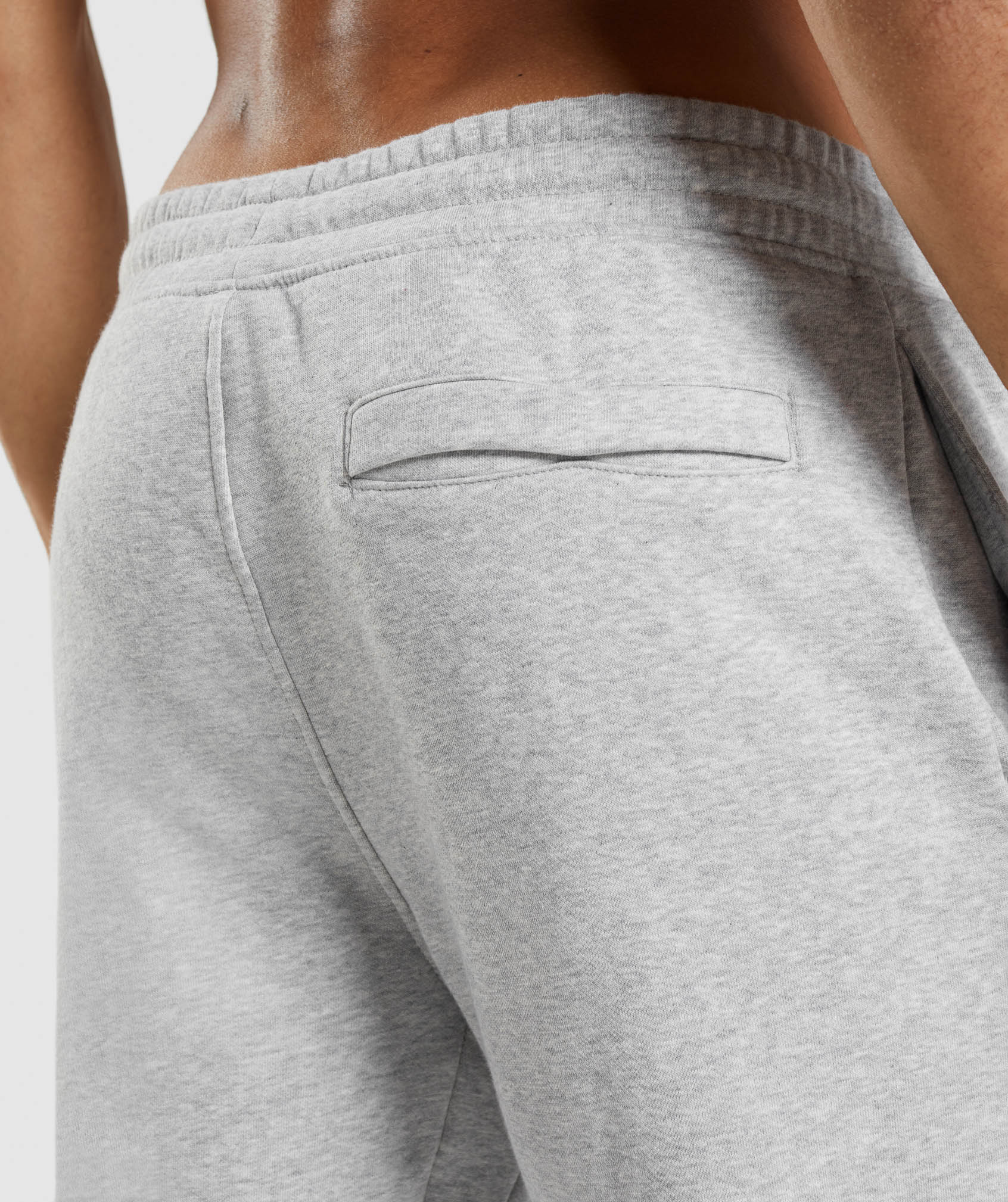 Pantalones Jogger Gymshark Crest Hombre Gris Claro | 9684320-YW