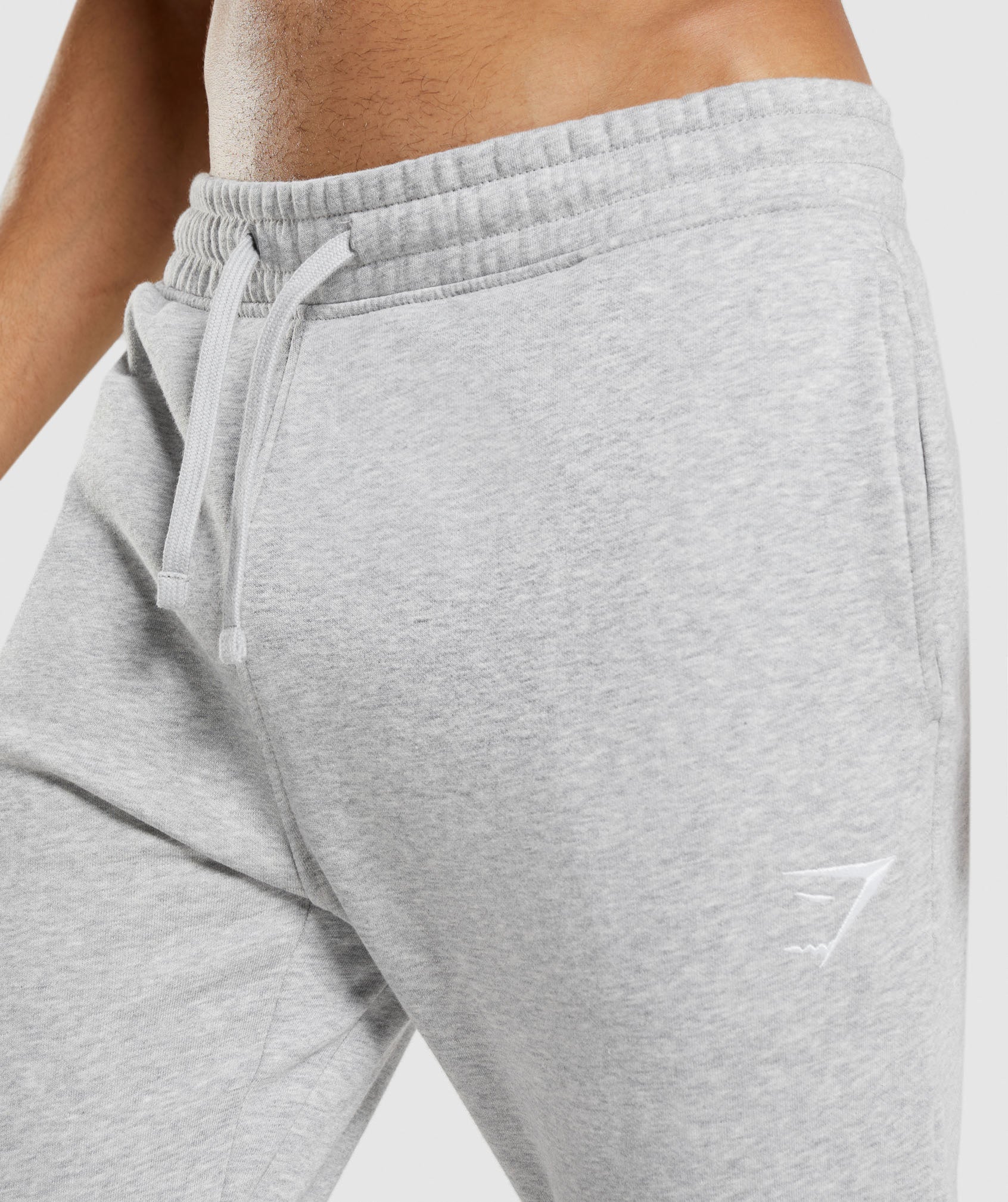 Pantalones Jogger Gymshark Crest Hombre Gris Claro | 9684320-YW