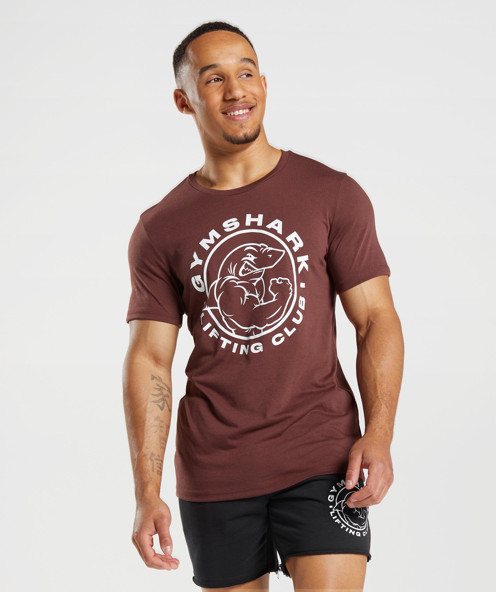 Camiseta Gymshark Legacy Hombre Rosas Marrones | 1547368-YE