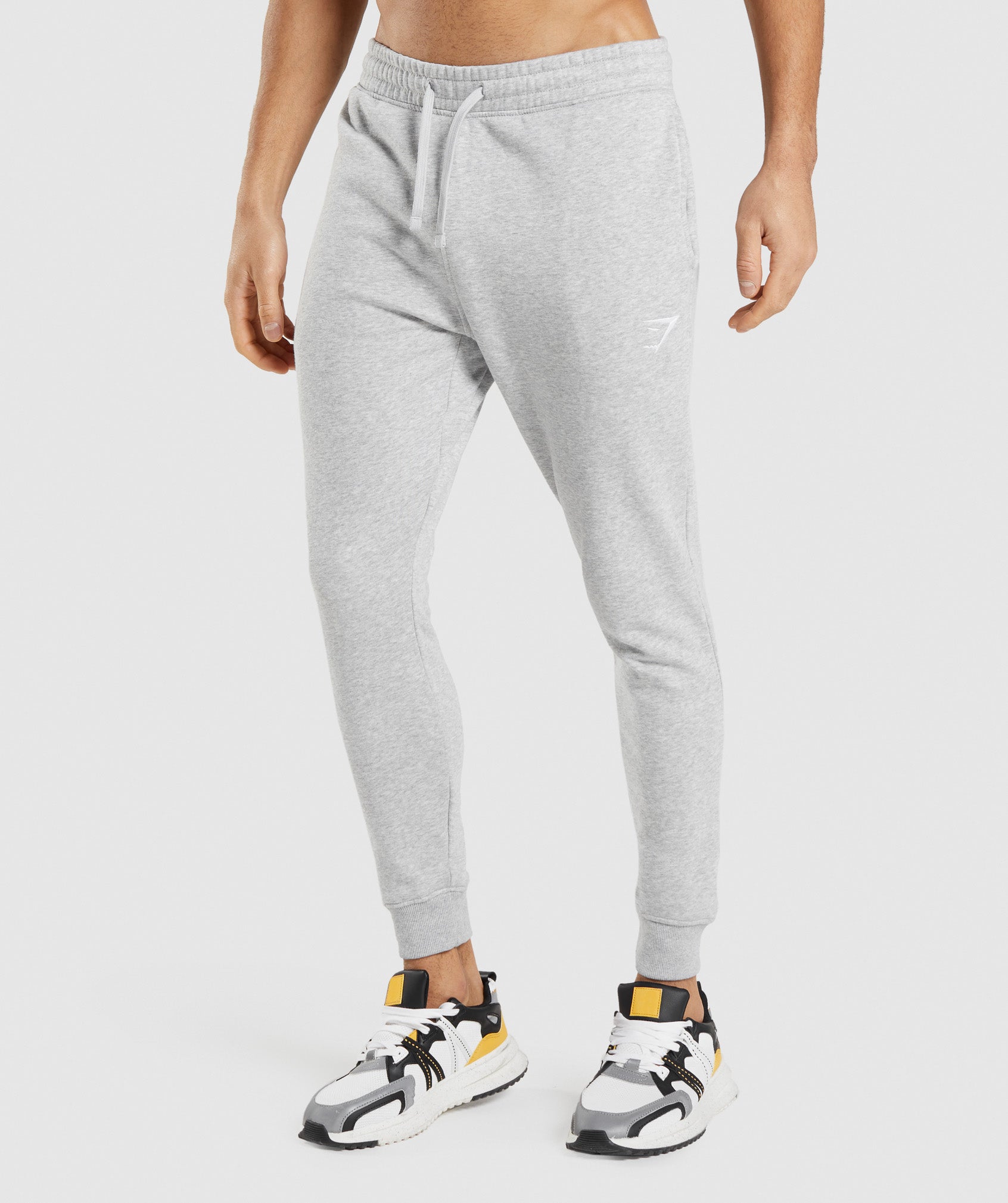 Pantalones Jogger Gymshark Crest Hombre Gris Claro | 9684320-YW